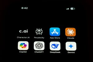A collage of various AI app icons Blogs
